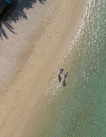 Couple Walking on the beach Mauritius Bel Ombre