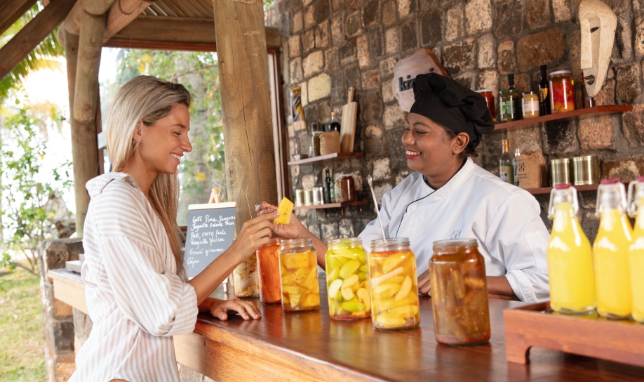 A guest enjoying Mauritian flavours at the Kizuri Corner at Heritage Awali