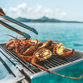 Delicious barbecue lunch and drinks served on board