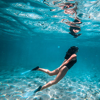 Stop to snorkel with the help of the crew if necessary