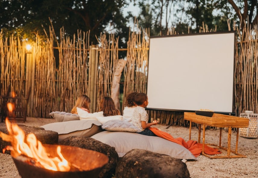 Children enjoying a movie night at Timomo Kids Club