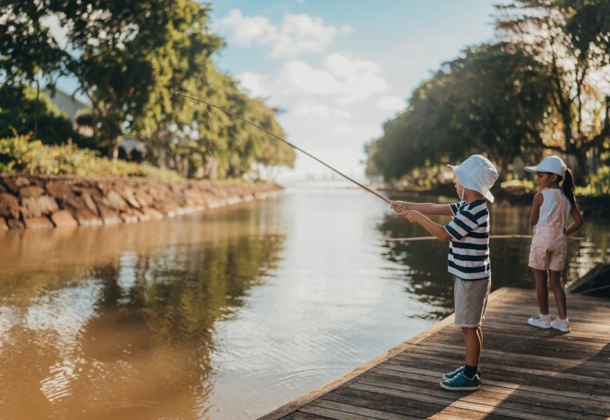 Children participating in a fishing activity at Timomo Mini Club, enjoying outdoor fun