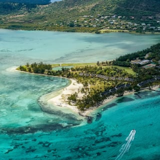 Aerial view of Paradis Golf Course with lush fairways and coastal backdrop