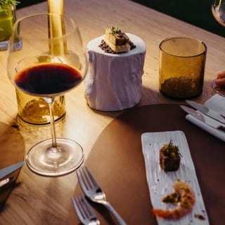 Aperitif served on the clubhouse terrace at La Réserve Golf Links