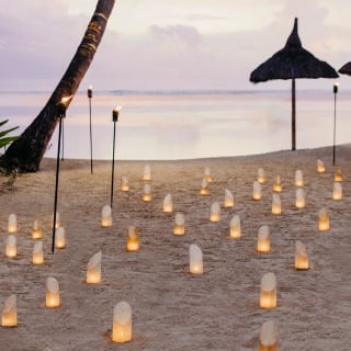 Candlelit dinner with the ocean as a backdrop