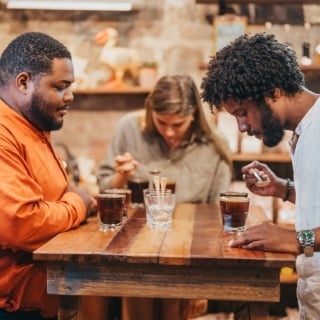 Visitors enjoying guided coffee cupping session