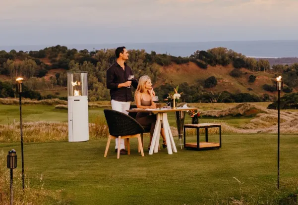 Couple enjoying a sunset dinner at La Réserve Golf Links, Mauritius