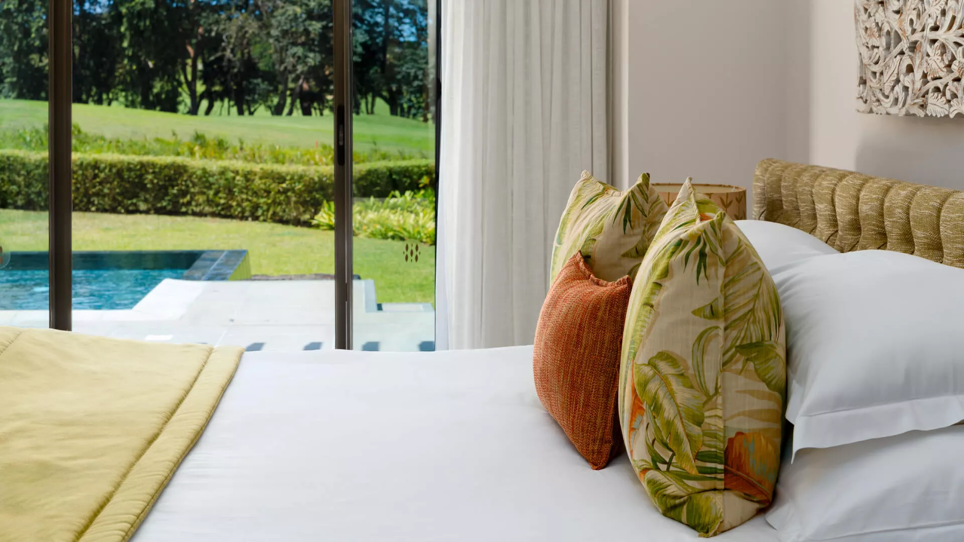 Close-up of stylish bed in 3 bedroom villa with pool view