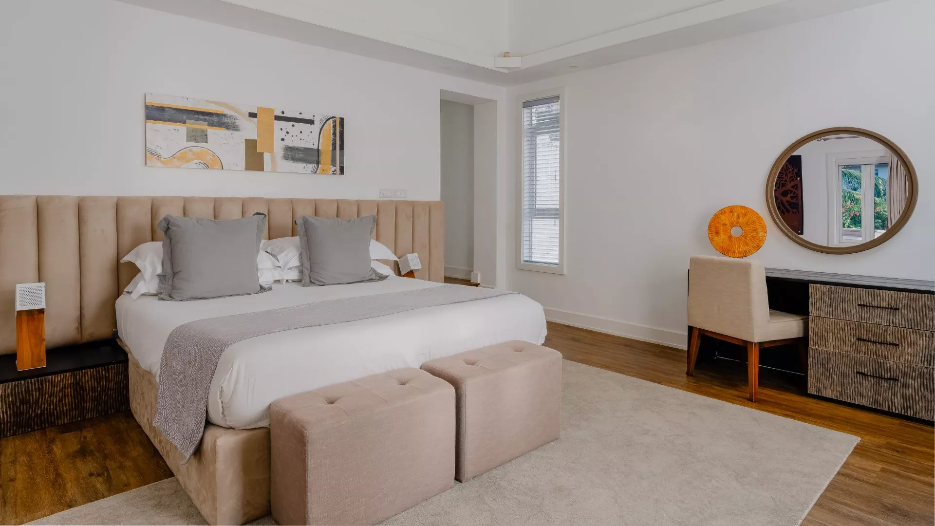 Side view of a bedroom in a four-bedroom villa featuring modern interior design and natural light