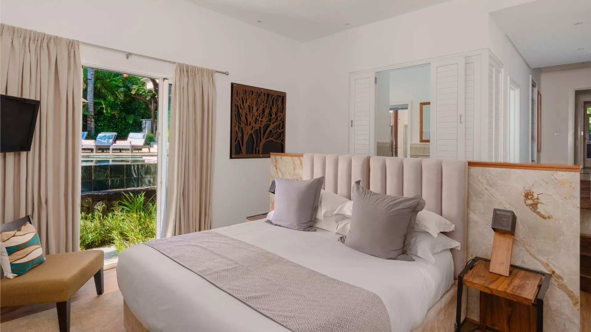 Luxury 4-bedroom villa bedroom with a Pool View on the side