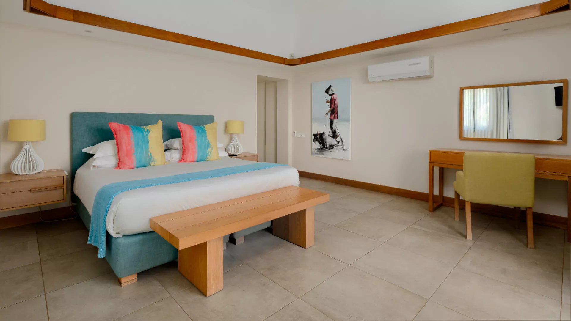 Front-facing view of a bedroom in a luxury three-bedroom villa with elegant interior styling