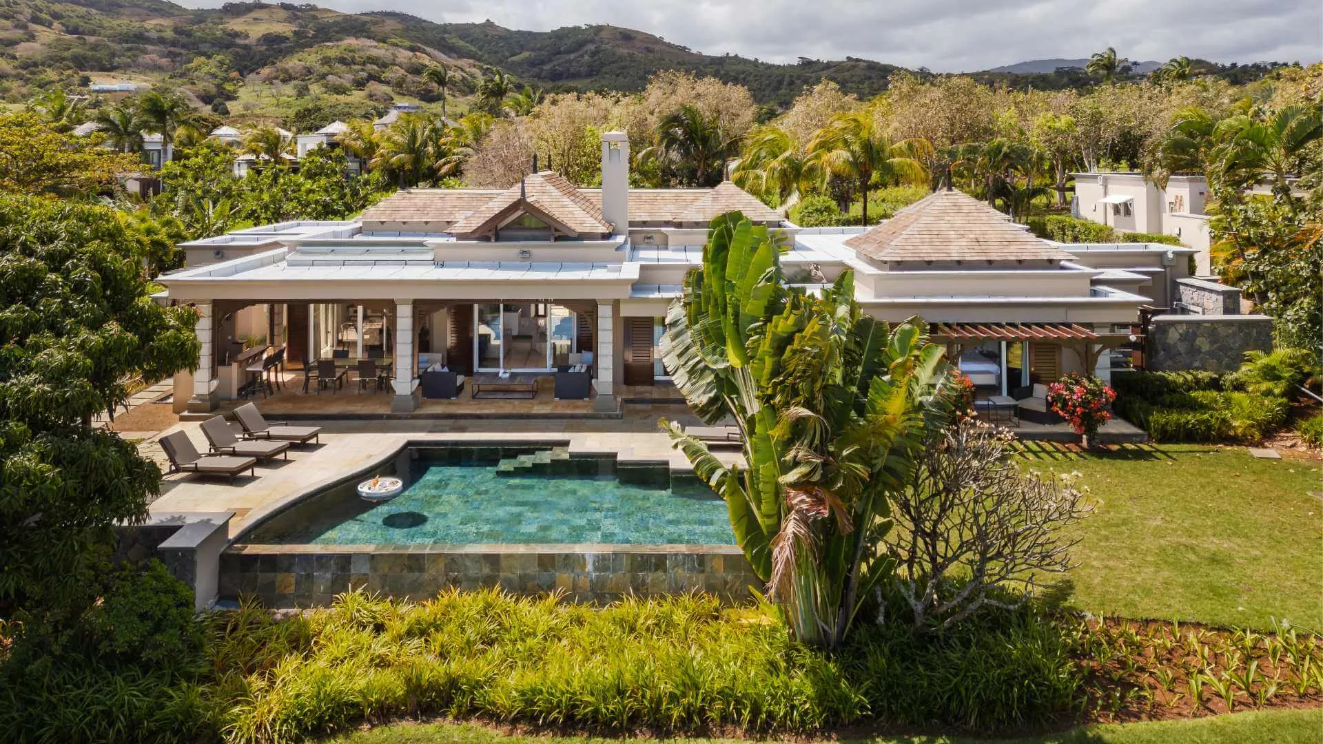 Front exterior view of a luxury 4-bedroom villa