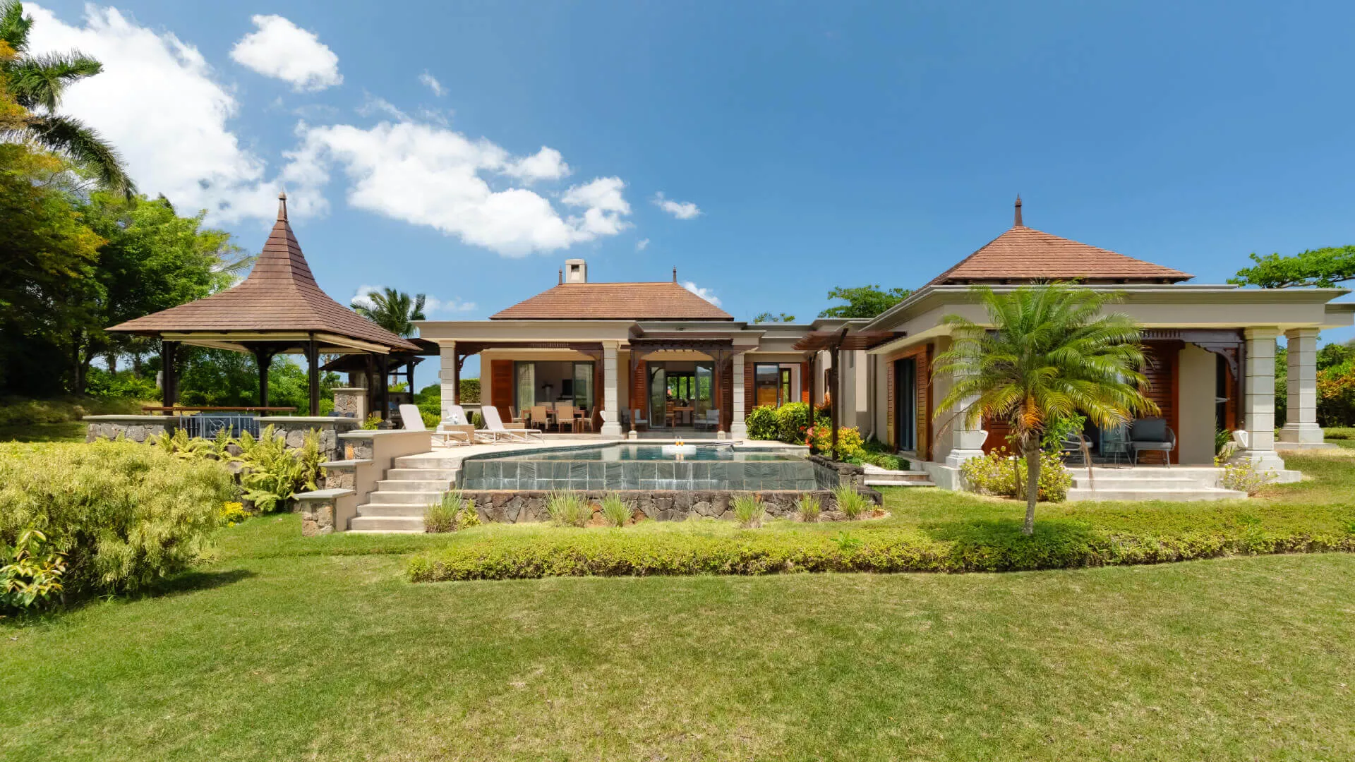 Front exterior view of a luxury 4-bedroom villa