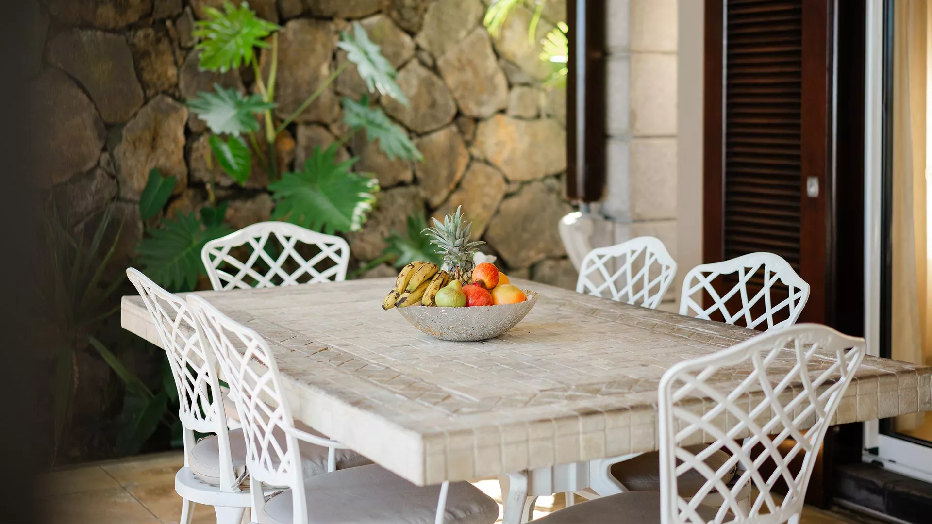 Outdoor terrace of a 3-bedroom villa overlooking the pool and ocean at Heritage The Villas, Mauritius