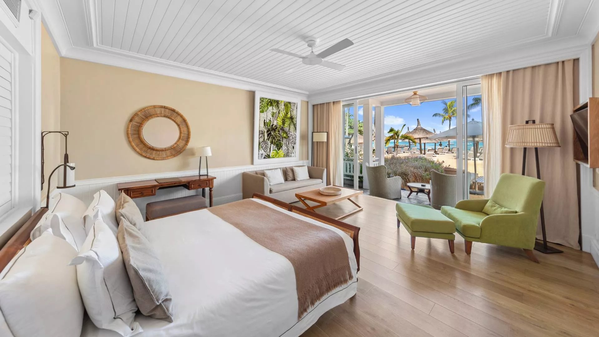 deluxe beachfront adult-only suite bedroom with outdoor view at heritage le telfair mauritius