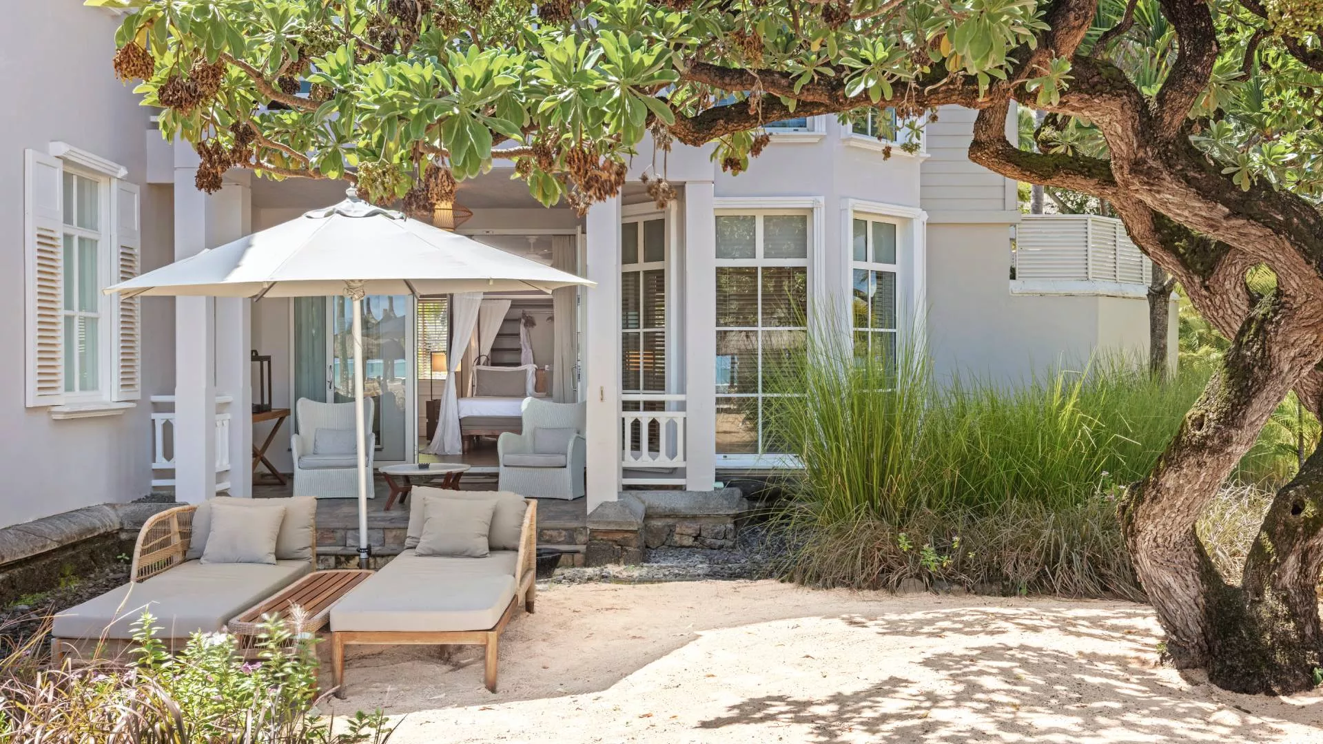 deluxe beachfront adult-only exterior view of suite at heritage le telfair mauritius