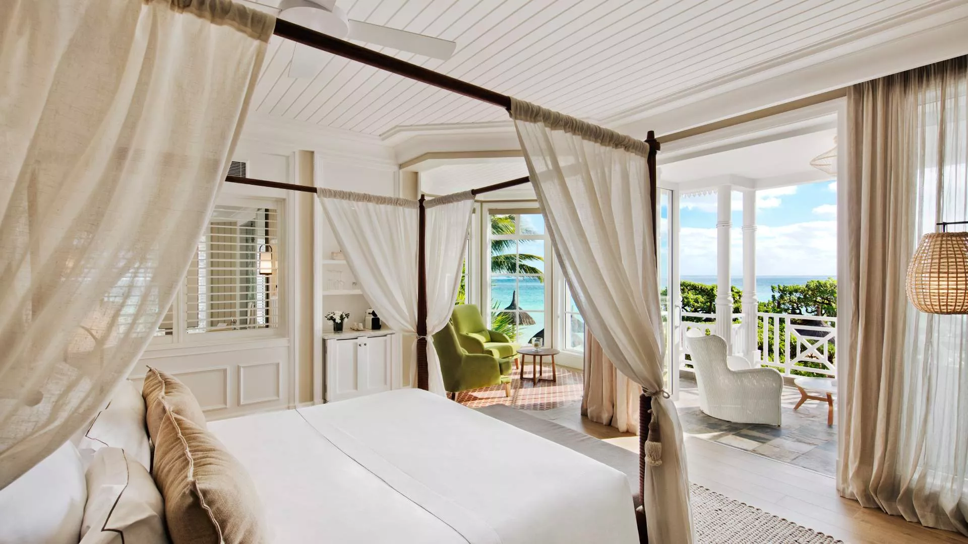 junior beachfront adult only suite bedroom with ocean view at heritage le telfair