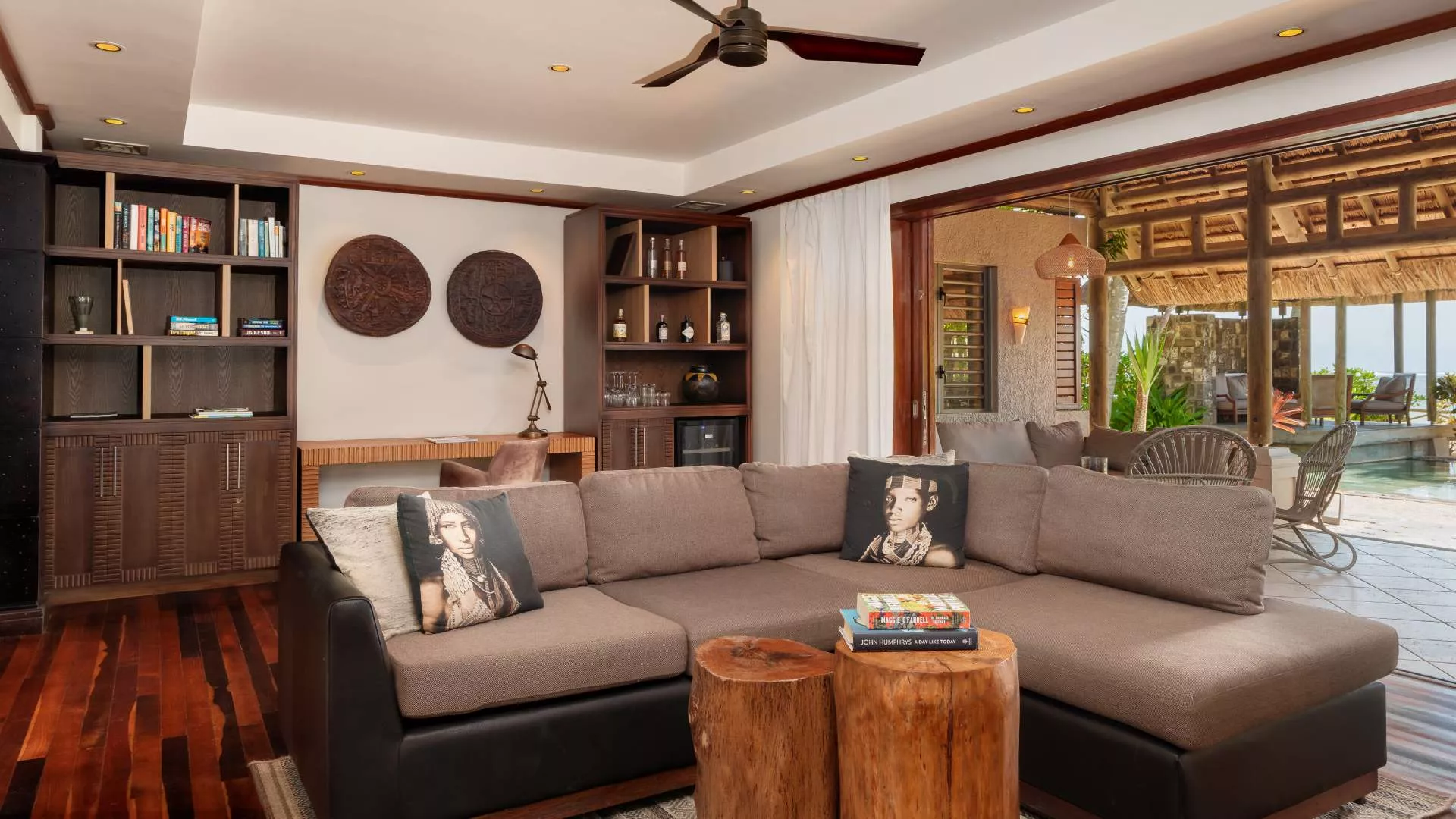 beachfront villa inspired african decor living room with stunning pool view