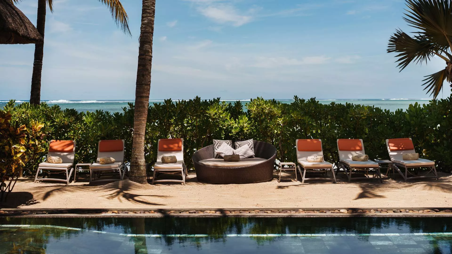 beachfront villa with spacious outdoor pool overlooking the ocean