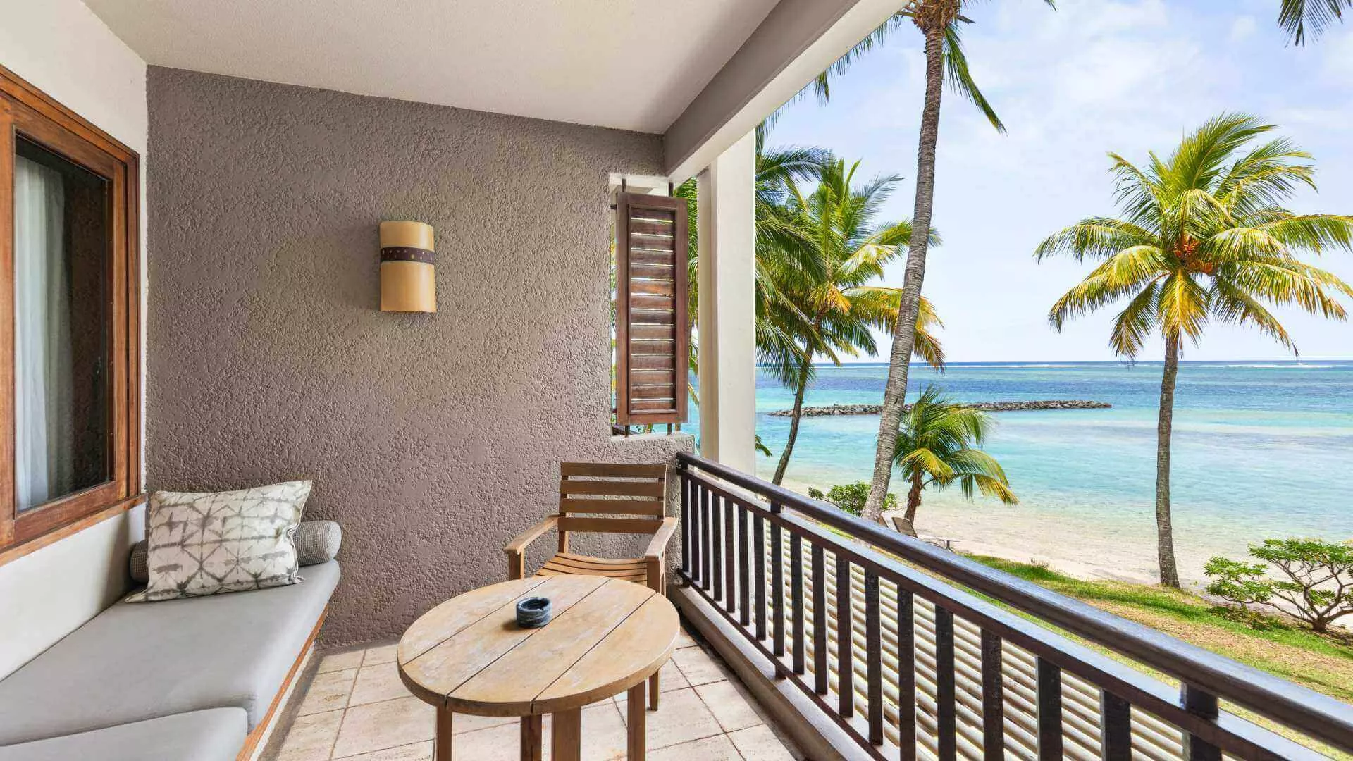 beachfront room with open balcony overlooking on the blue ocean heritage awali 