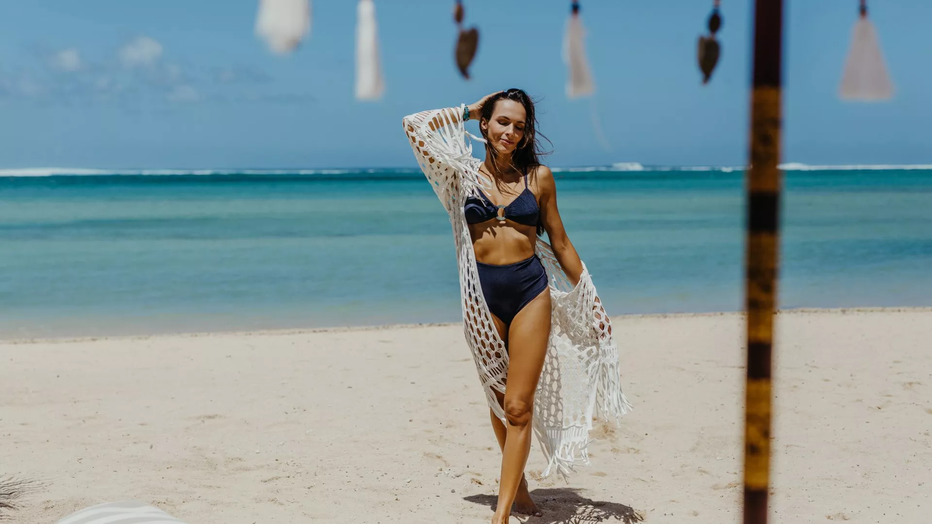 woman enjoying sunny weather beach holidays