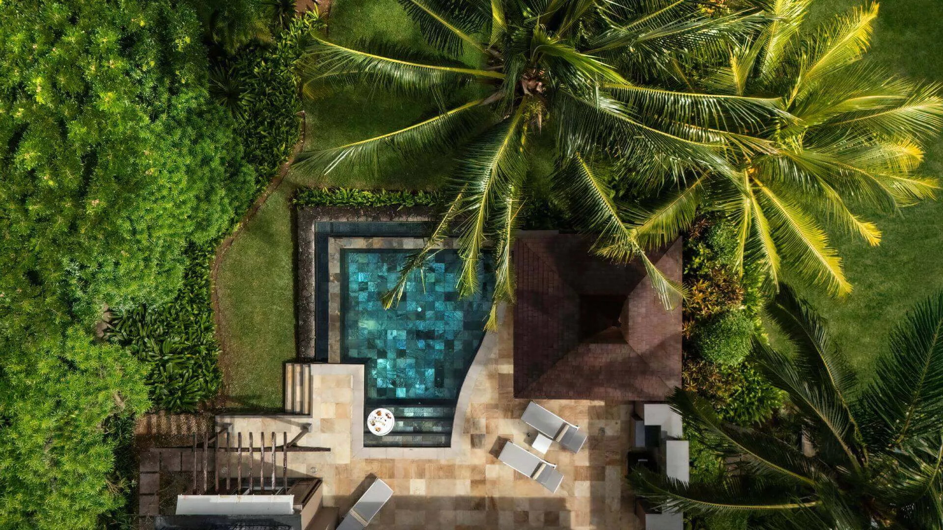 Pool area with garden view at Heritage The Villas Mauritius