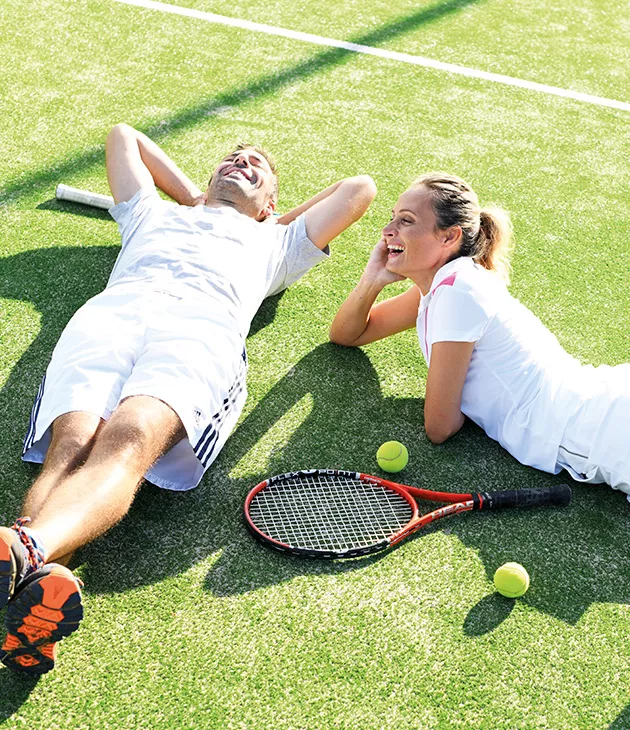 Couple Playing tennis at Heritage Resorts Mauritius