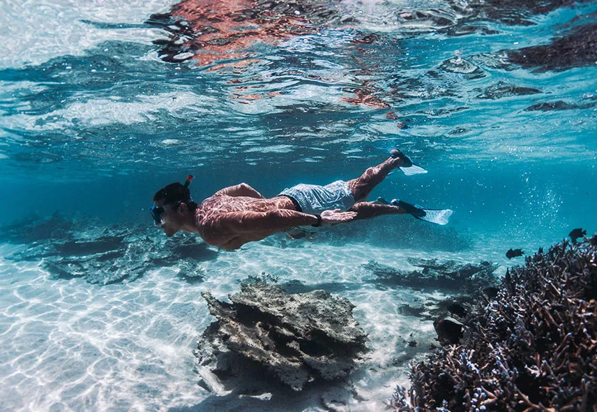 Snorkelling in blue crystal water in Mauritius