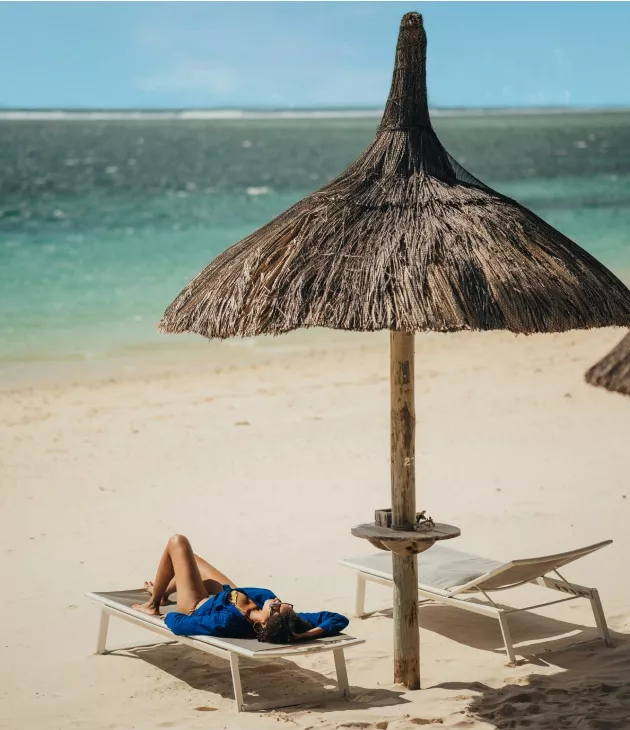 Woman relaxing on eastern beach of Mauritius