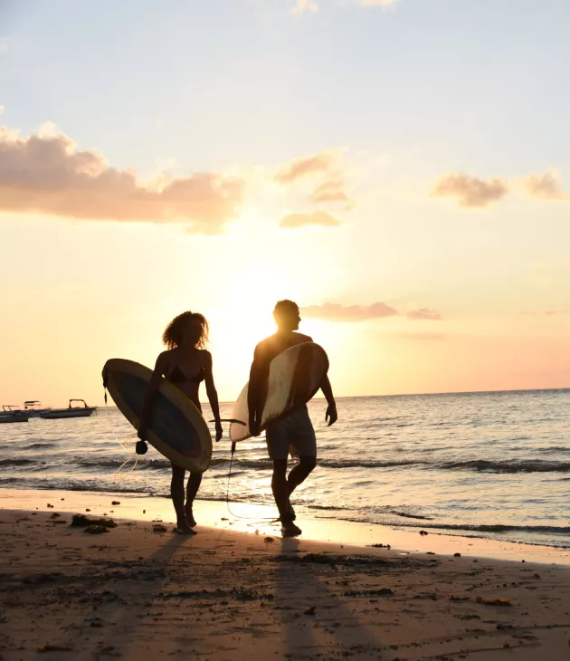 Couple walking on western beach of Mauritius