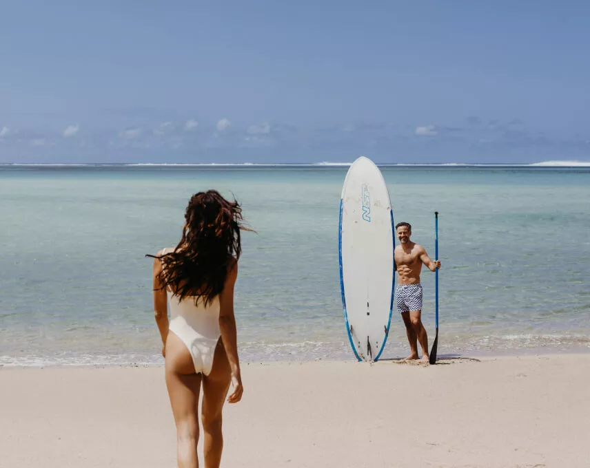 Couple enjoying a paddle activity on the beach in Mauritius