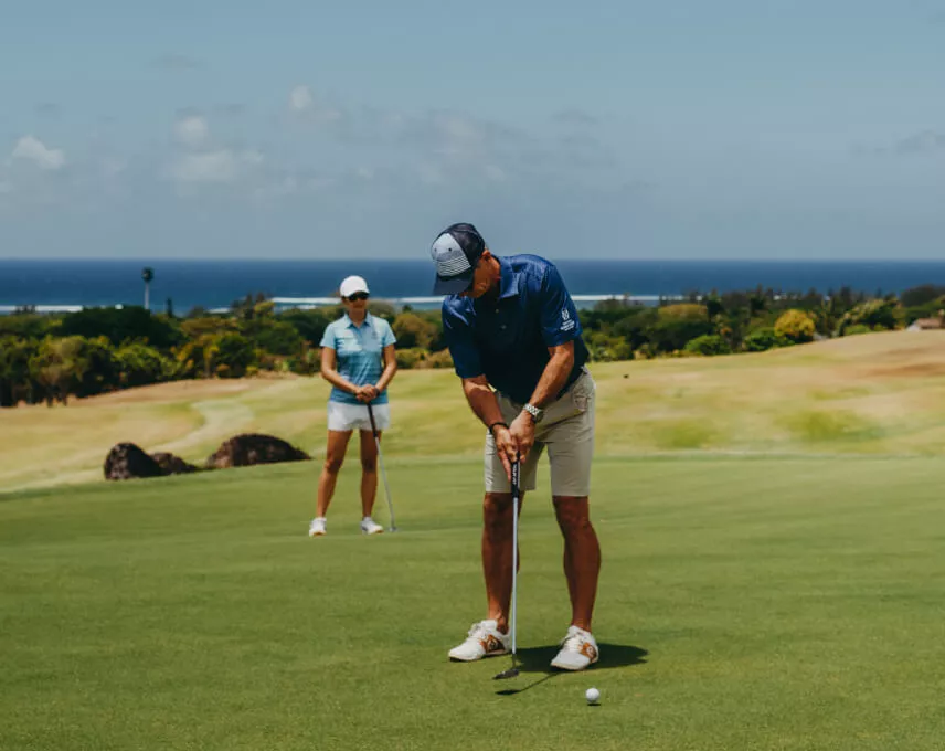 Golfers enjoying a round of golf on a sunny course - Heritage Golf Club