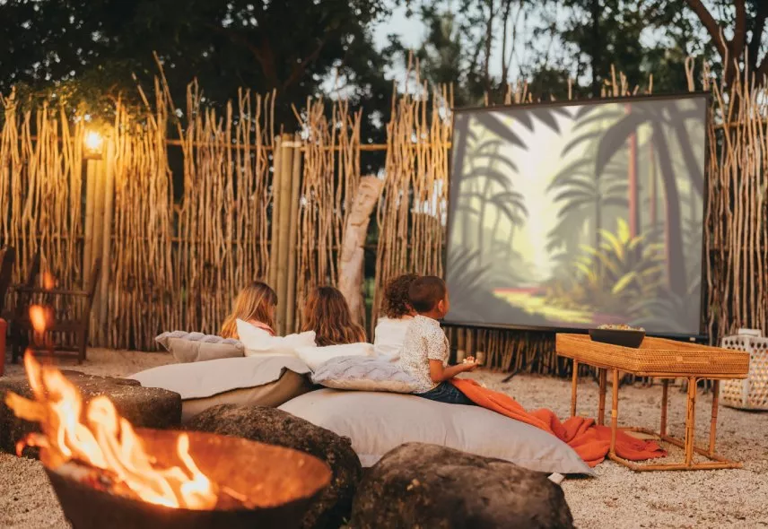 Kids enjoying movie night at Timomo Kids Club