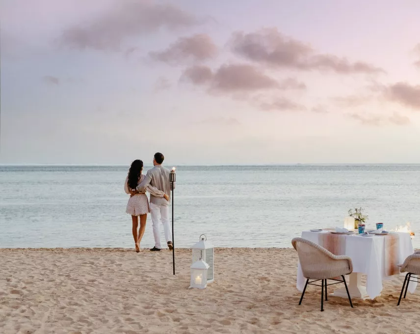 Couple having a romantic dinner on the beach