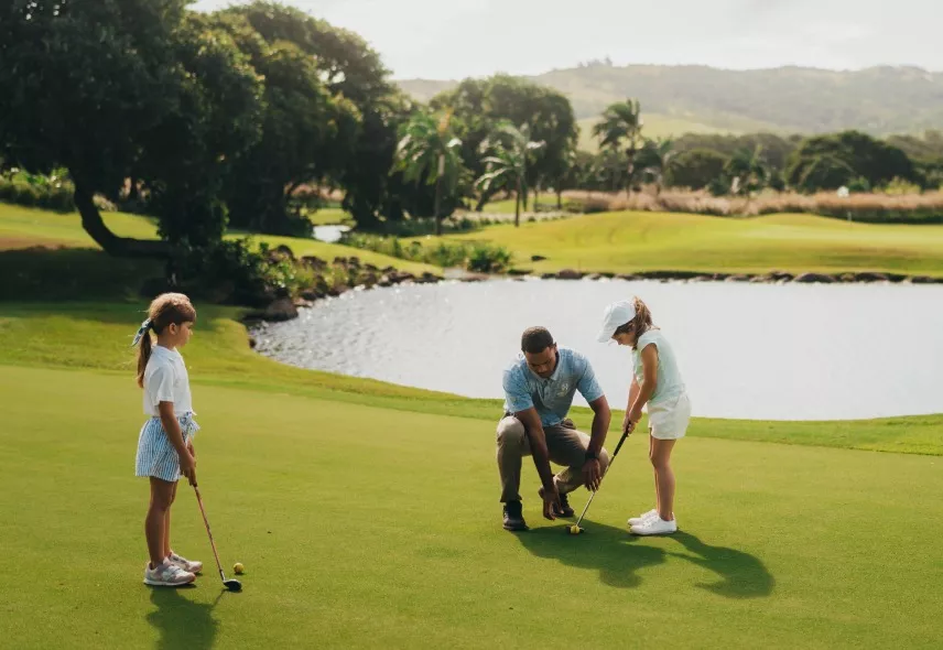 Children learning to play golf