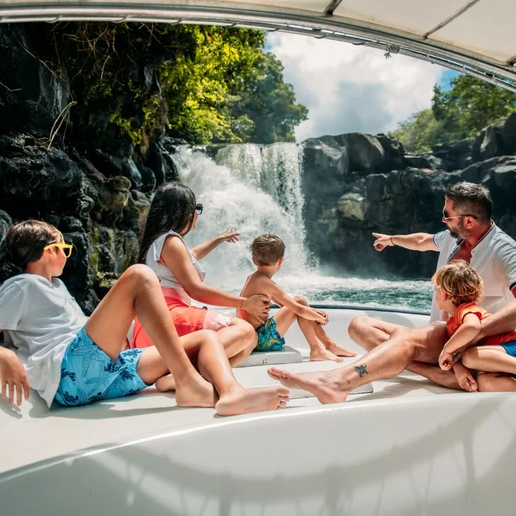 Family enjoying a catamaran cruise to nearby islets of Mauritius