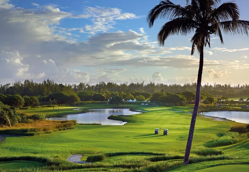 Golfer swinging at Le Château Golf Course in Mauritius