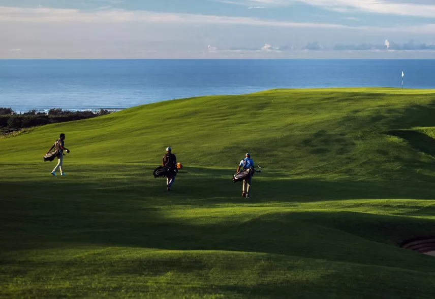 Golfers walking on La Réserve Golf Links course in Mauritius