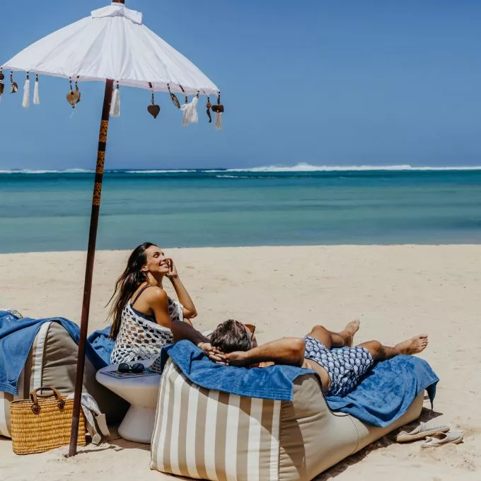 couple relaxing on beach at heritage le telfair  mauritius