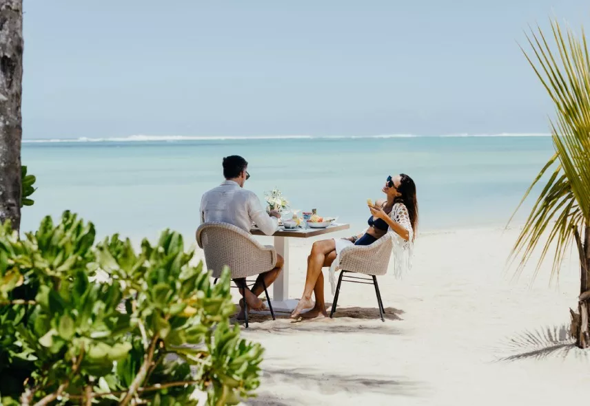 couple morning beach breakfast at heritage resorts mauritius