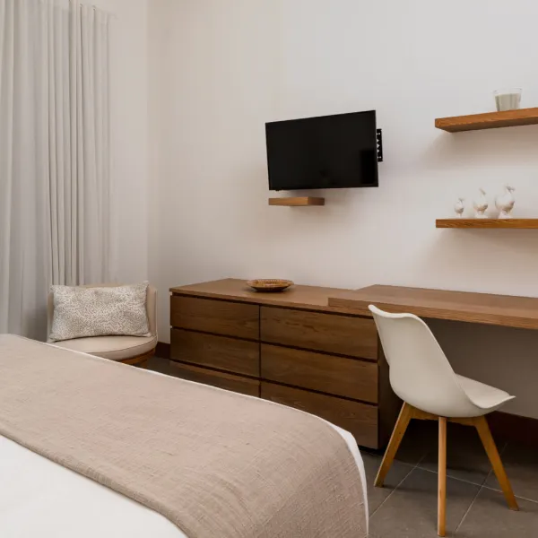 Bedroom with desk and bed in a luxury 2-bedroom villa