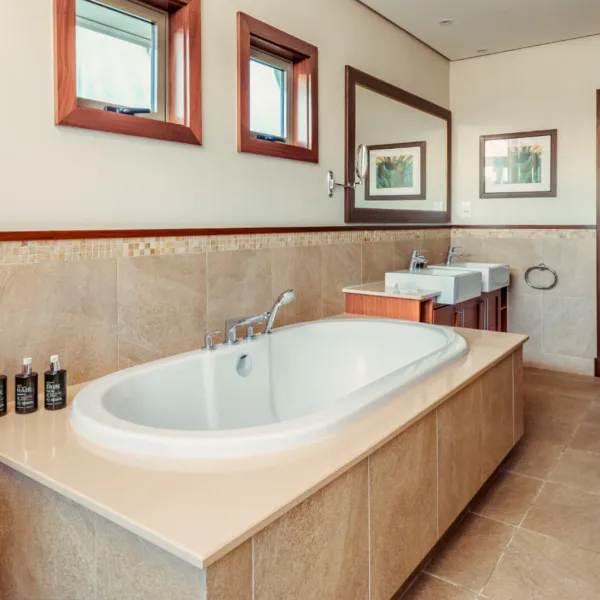 Bathtub in the bathroom of a three-bedroom villa at Heritage The Villas, Mauritius