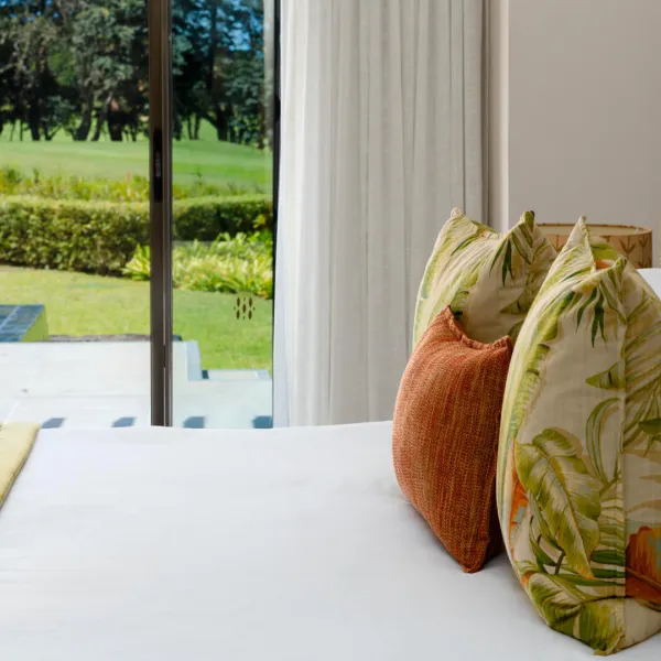 Close-up of stylish bed in 3 bedroom villa with pool view