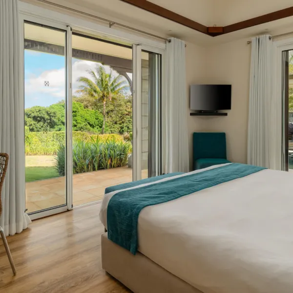 Side-angle view of the 3-bedroom villa showcasing its architecture and exterior surrounding greenery.