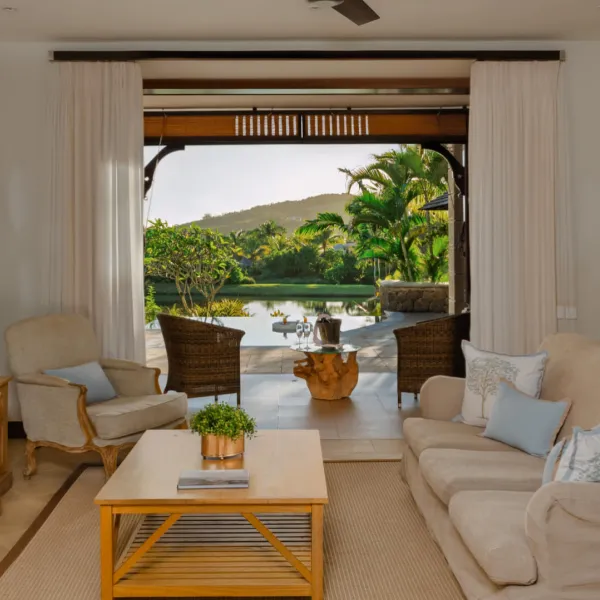 Luxury living room in a three-bedroom villa with side pool view at Heritage The Villas, Mauritius