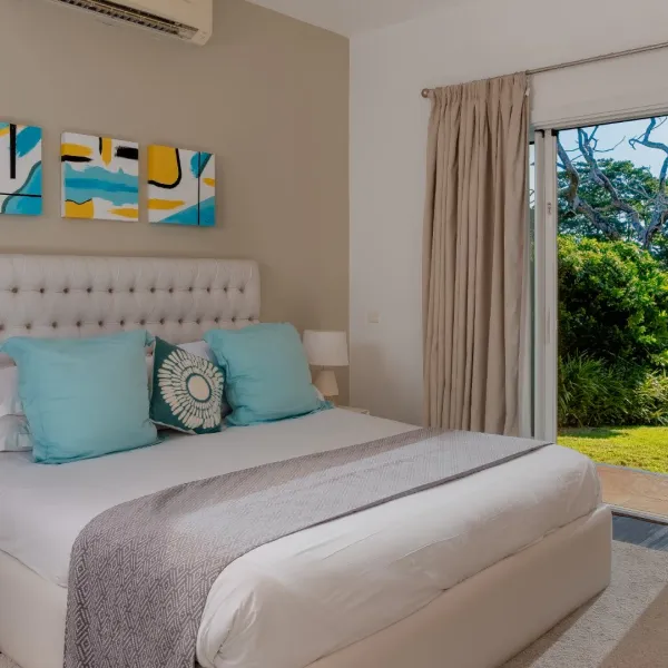 Ground floor bedroom in a four-bedroom villa with modern architectural details