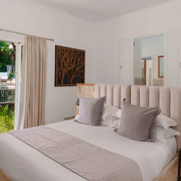 Luxury 4-bedroom villa bedroom with a Pool View on the side