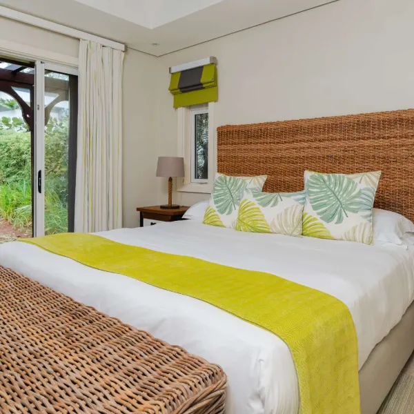 Exterior view of a luxury 4-bedroom villa with scenic surroundings