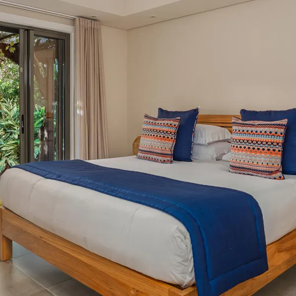 Third bedroom of a 4-bedroom villa with pool view at Heritage The Villas, Mauritius