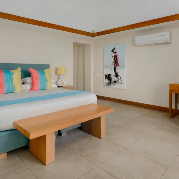 Front-facing view of a bedroom in a luxury three-bedroom villa with elegant interior styling